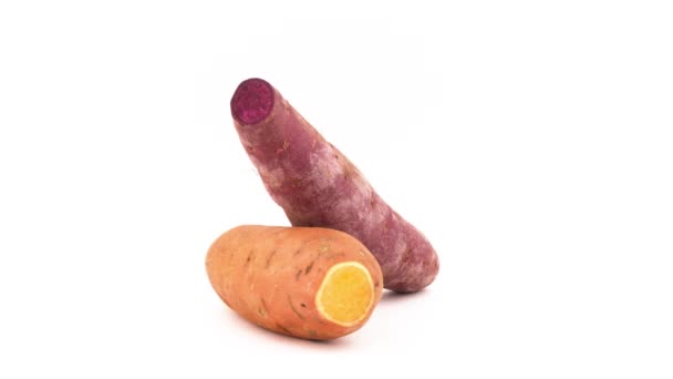 One Whole Orange Sweet Potato One Purple Batata Rotating Turntable — Stock Video