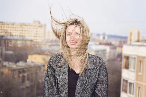 Portrait of a blonde woman in a gray coat. — Stock Photo, Image