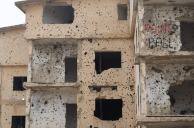 Beqaa, Lebanon, April 04 - 2017: Marks of War, Lebanese house machine-gunned, bombed, destroyed by civil war, Lebanon mountains. clipart