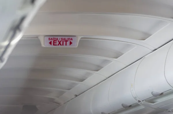 Emergency exit sign on a passenger plane