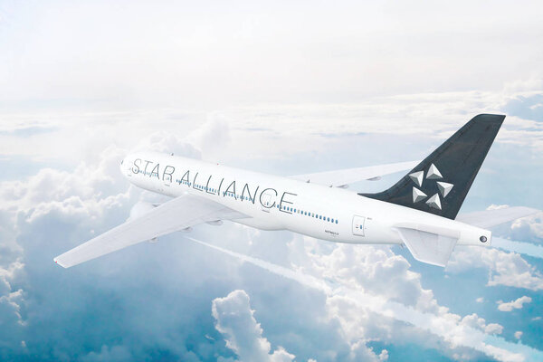  Star Alliance Group Member aircraft flying high above the clouds.