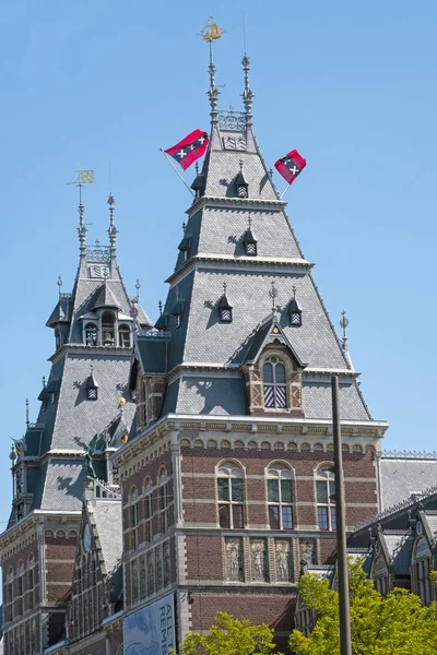 The flags from Amsterdam in the Netherlands on the towers of the — Stock Photo, Image