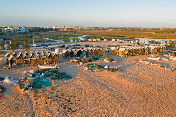 Aerial from traditional fishermen huts on the beach in Armacao de Pera in Portugal — Stock Photo, Image