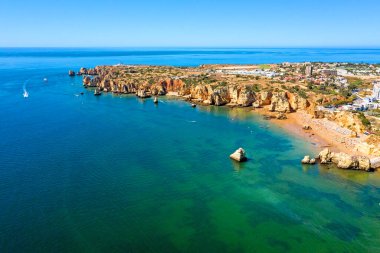 Aerial from Praia do Camillo on a rocky southcoast near Lagos in Portugal clipart