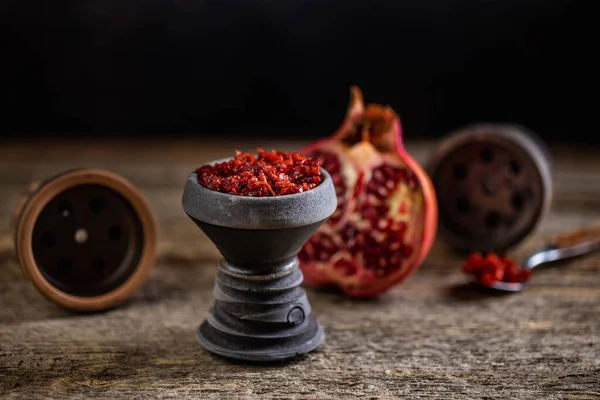 Arabian stone hookah head filled with pomegranade flavoured tobacco