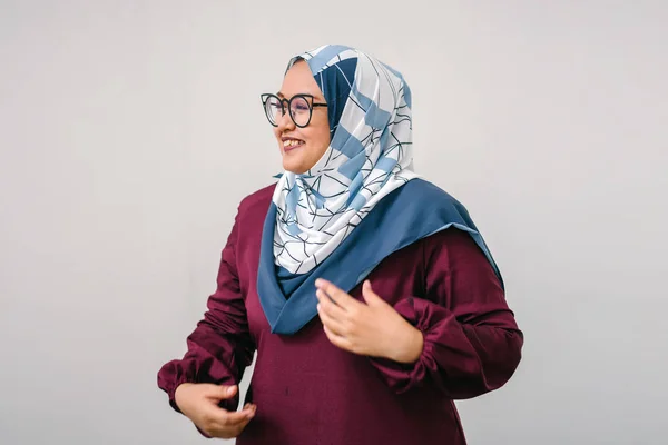 asian woman wearing hijab, half length portrait