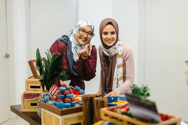 Two Women Smiling Standing Table Preparing Snacks Celebrating Holiday — Stock Photo, Image