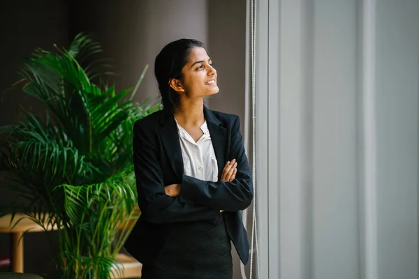Portrait Young Businesswoman Standing Arms Crossed Smiling Looking Window — Stock Photo, Image