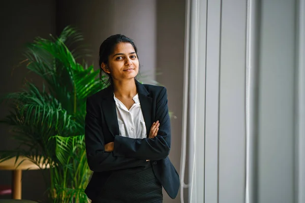 Portrait Young Businesswoman Standing Arms Crossed Smiling Looking Window — Stock Photo, Image