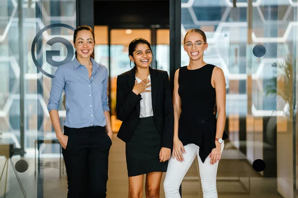 Three Young Businesswomen Laughing Standing Modern Office — Stock Photo, Image