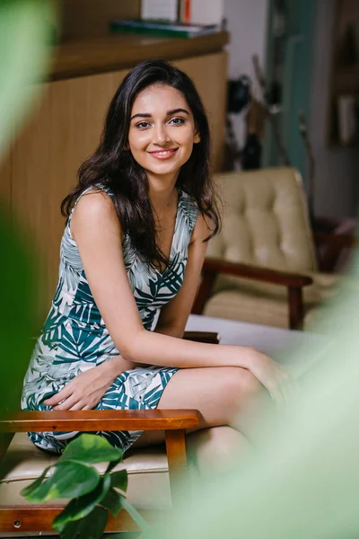 Portrait of a young, attractive and confident Indian Asian woman in a dress