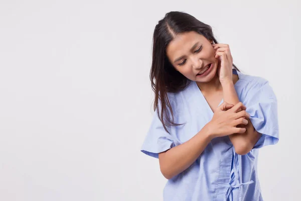 itching woman scratching her skin