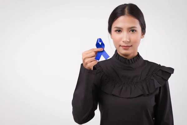 Woman Hand Holding Blue Ribbon Bow Colon Cancer Awareness Symbol — Stock Photo, Image