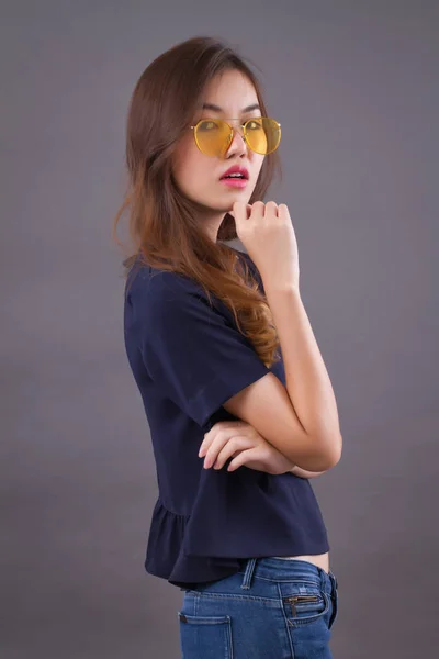 confident girl, happy woman; portrait of confident, positive, happy, successful asian woman in casual dress studio isolated; asian young adult woman model