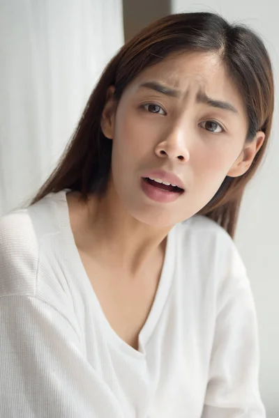surprised woman shrugging, getting angry with you; furstrated and surprised asian woman showing questioning face expression; asian persian woman or asian middle east mixed race 20s young adult model