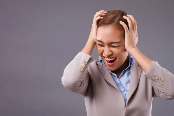 Tired unhappy business woman suffer from headache; sad exhausted depressed businesswoman with symptoms of headache, stress, migraine, depression; mental sickness problem concept; Asian woman model