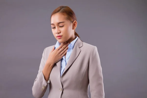 sick woman with sore throat portrait; sick asian woman with sore throat, cold, flu, contagious disease; pain, sickness and health care concept; young adult asian woman model