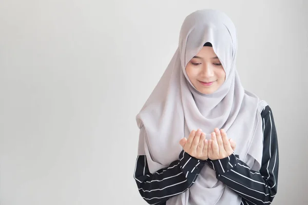 Stock image young modern asian muslim woman with islamic prayer hand; concept of Ramadan, Eid al Fitr, meditation, islamic praying, islam festival, muslim religious activities