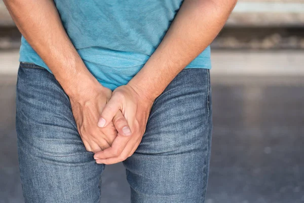 Sick man holding his genitalia; concept of pee holding, lack of toilet, prostate cancer, UTI or urinary tract infection — Stock Image Sick Man Holding His Genitalia Concept Pee Holding Lack Toilet Royalty Free Stock Images