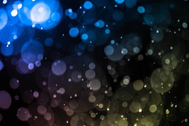 Bokeh 'te noel arkaplanı deseni soyut ışık parıldayan yıldızlar. simli klasik ışık arkaplanı