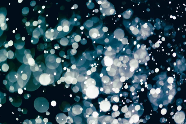 圣诞节的背景质感抽象的明亮的星星在Bokeh上 亮晶晶的老式彩灯背景 — 图库照片