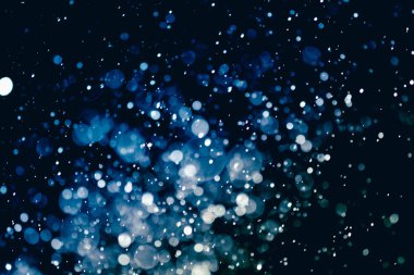 Bokeh 'te noel arkaplanı deseni soyut ışık parıldayan yıldızlar. simli klasik ışık arkaplanı