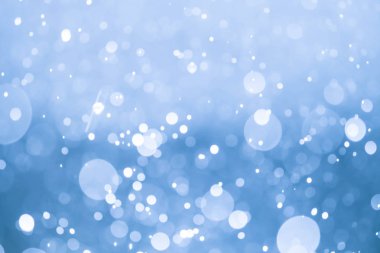 Bokeh 'te noel arkaplanı deseni soyut ışık parıldayan yıldızlar. simli klasik ışık arkaplanı