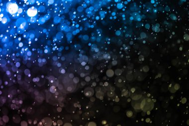 Bokeh 'te noel arkaplanı deseni soyut ışık parıldayan yıldızlar. simli klasik ışık arkaplanı