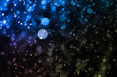 Bokeh 'te noel arkaplanı deseni soyut ışık parıldayan yıldızlar. simli klasik ışık arkaplanı