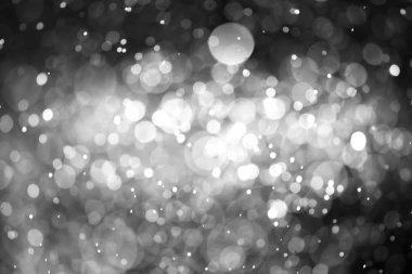 Bokeh 'te noel arkaplanı deseni soyut ışık parıldayan yıldızlar. simli klasik ışık arkaplanı