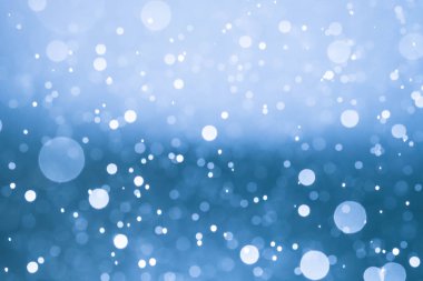 Bokeh 'te noel arkaplanı deseni soyut ışık parıldayan yıldızlar. simli klasik ışık arkaplanı