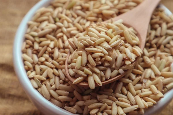 Raw Brown Rice Spoon Bowl Top View Food Background — Stock Photo, Image