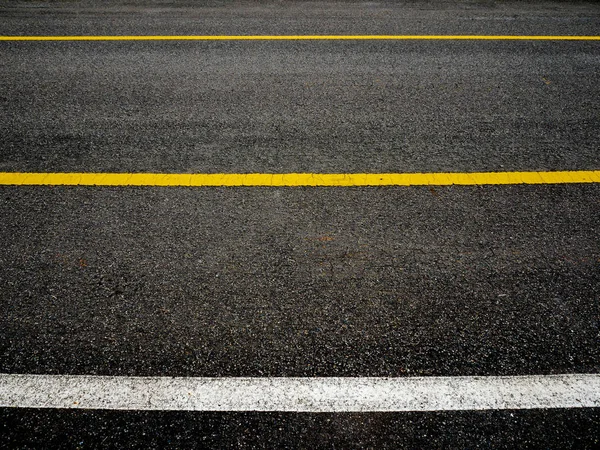 Asphalt surface of road with lines abstract background