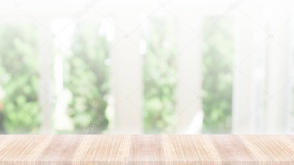 Wooden table top on green nature background