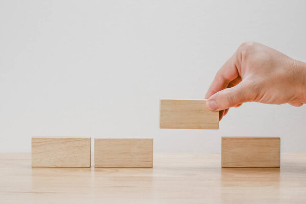 business finance. growing Profit concept,Hand arranging wood block