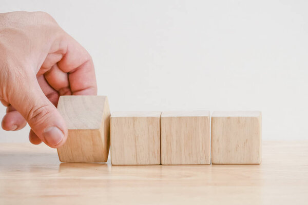 business finance. growing Profit concept,Hand arranging wood block