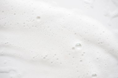 Arka plan beyaz sabunlu köpük doku. Şampuan köpük ile 