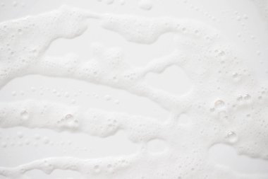 Arka plan beyaz sabunlu köpük doku. Şampuan köpük ile 
