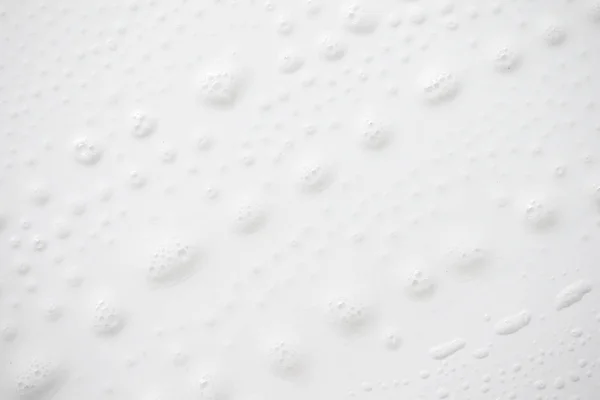 抽象背景白色肥皂泡沫纹理。洗发水泡沫与 — 图库照片
