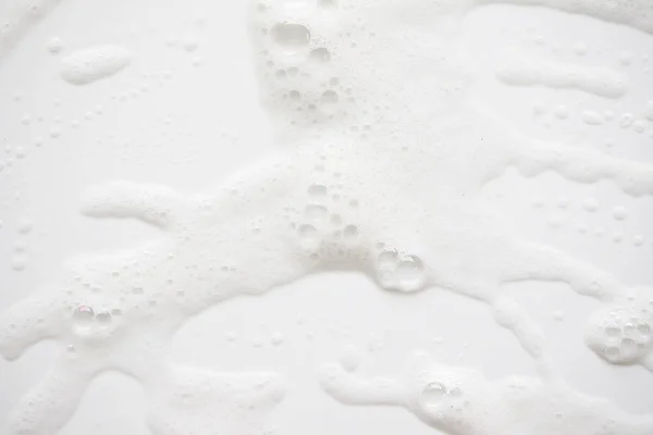 Absztrakt háttér fehér szappanos foam textúra. Sampon hab — Stock Fotó