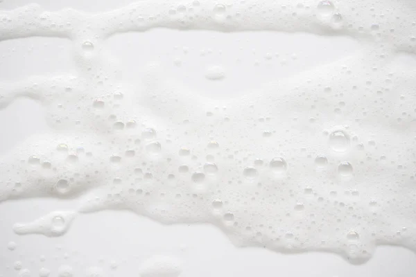 Fundo abstrato textura de espuma de sabão branco. Espuma de champô com — Fotografia de Stock