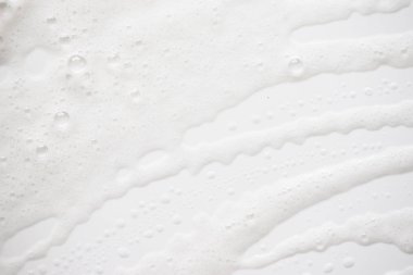 Arka plan beyaz sabunlu köpük doku. Şampuan köpük ile 