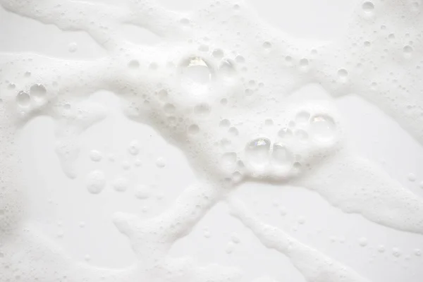 Tekstura tło białe mydlanej piany. Szampon pianka z — Zdjęcie stockowe