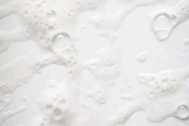 Arka plan beyaz sabunlu köpük doku. Şampuan köpük ile 
