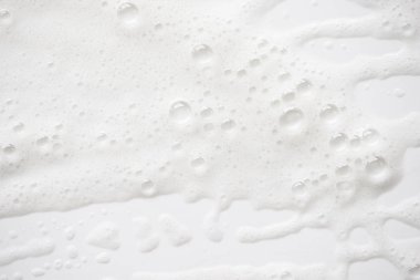 Arka plan beyaz sabunlu köpük doku. Şampuan köpük ile 