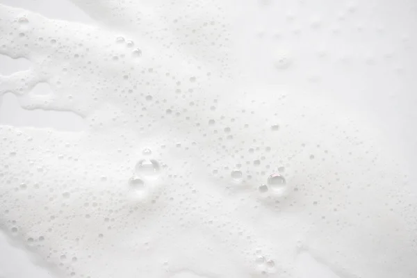 抽象背景白色肥皂泡沫纹理。洗发水泡沫与 — 图库照片