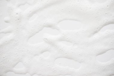 Arka plan beyaz sabunlu köpük doku. Şampuan köpük ile 