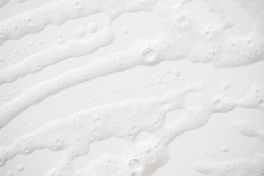 Arka plan beyaz sabunlu köpük doku. Şampuan köpük ile 