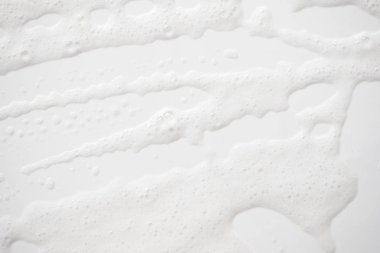 Arka plan beyaz sabunlu köpük doku. Şampuan köpük ile 