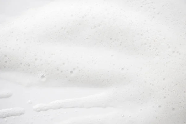 Tekstura tło białe mydlanej piany. Szampon pianka z — Zdjęcie stockowe
